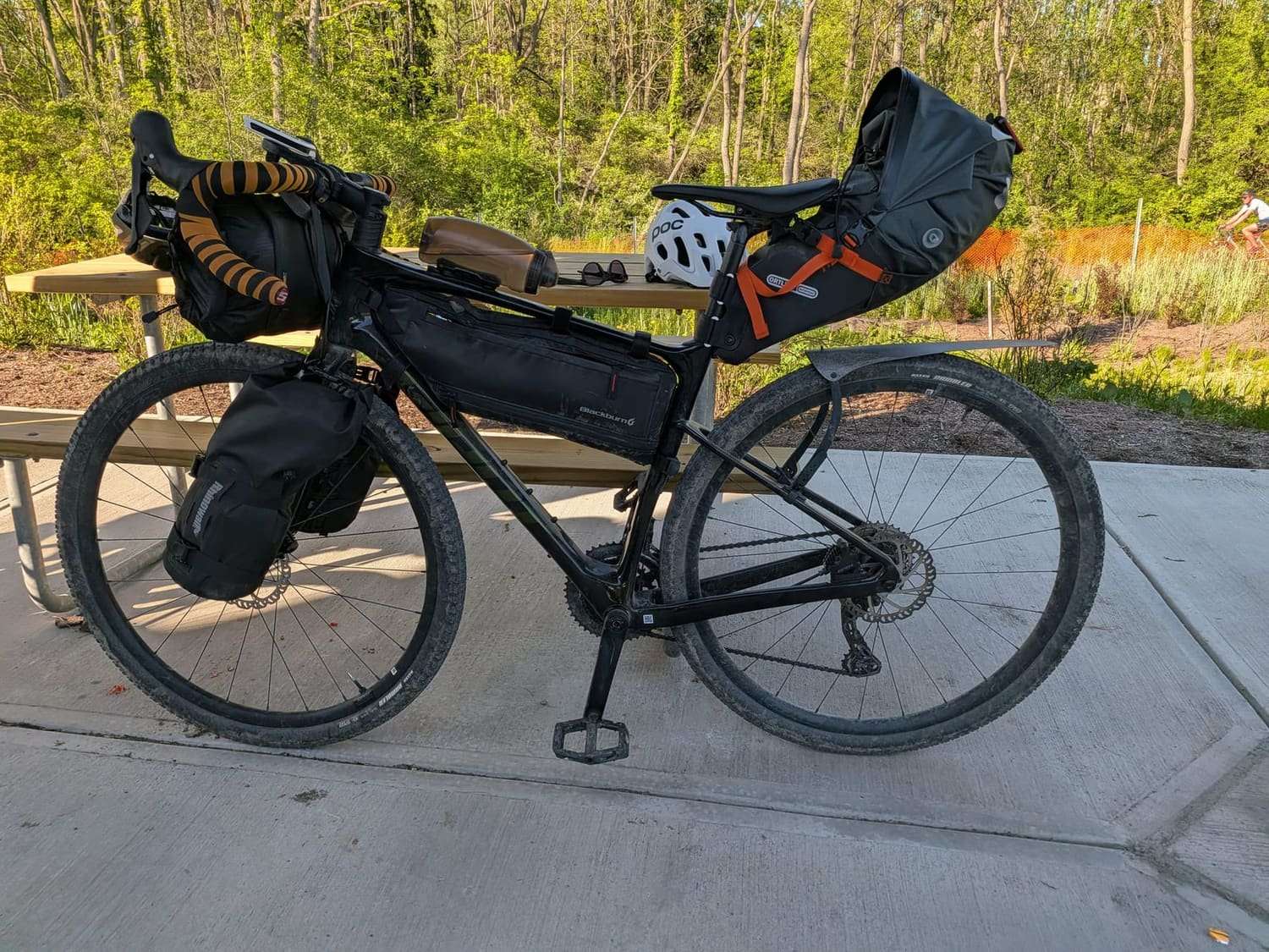 A gravel bike loaded with frame, bar and saddle bags